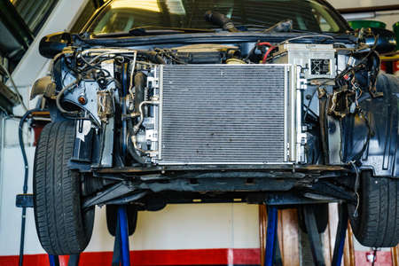 Car in service. Auto raised on lift in autoservice.の写真素材