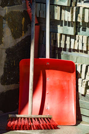 Red broom and shovel outdoor at home. Cleaning set equipmentの写真素材