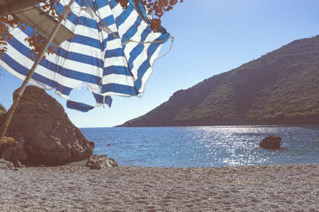 Sea and sandy Vlychada beach at sunny day. Tranquil scene. dyllic relaxation place in Greece.の写真素材