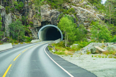 Road with tunnel in summer mountains, Narwayの写真素材