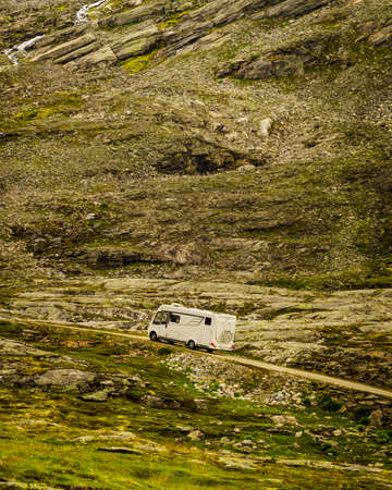 Camper in norwegian mountains. Camping on nature. Traveling, holidays and adventure concept.の写真素材