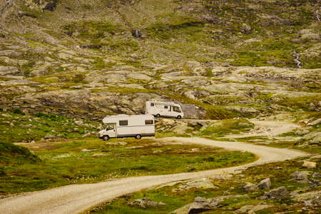 Camper cars old and new type in norwegian mountains. Camping on nature. Traveling, holidays and...