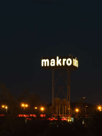 GDANSK, POLAND - AUGUST 16, 2014: Makro sign at night. Makro is an international brand of warehouse clubs, also called cash and carries.のeditorial素材