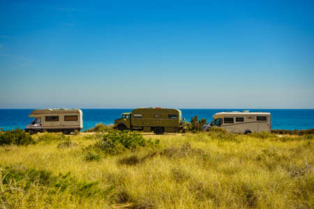 SANTA POLA, SPAIN - FEBRUARY 28, 2019: Campers, recreational vehicles on mediterranean coast of seaside spanish Santa Pola city on the Costa Blancaの写真素材