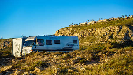 SANTA POLA, SPAIN - FEBRUARY 6, 2019: Campers, recreational vehicles on mediterranean coast of seaside spanish Santa Pola city on the Costa Blancaのeditorial素材