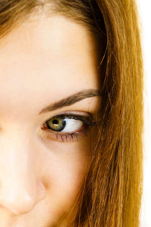 Young woman brown hair without makeup. Part of face, eye. Natural beauty. Purity skincare spa treatment.の写真素材