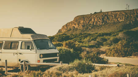 Camper van recreational vehicle on mediterranean coast in Spain. Camping on nature beach. Holidays...