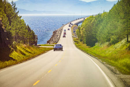 BOLSOYA, NORWAY - JULY 10, 2018: Road bridge Bolsoya, coastal landscape in Norway Europe. Norwegian...