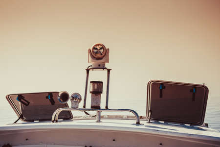 Yacht equipment on sailing boat roof. Yachting details and objects concept. Sepia shotの写真素材