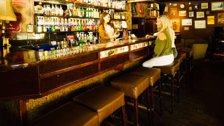 KARTUZY, POLAND - OKTOBER 27, 2018: People inside Antykvariat Cafe in Kartuzy city, Kashubia Polandの写真素材