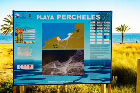 PERCHELES BEACH, SPAIN - MARCH 16, 2019: Percheles Beach information board, mediterranean coast in...