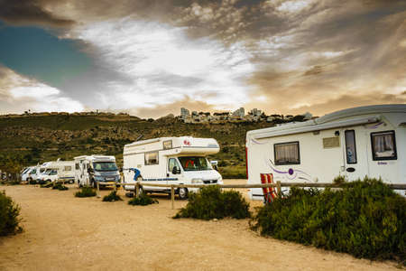 SANTA POLA, SPAIN - FEBRUARY 10, 2019: Campers, recreational vehicles on mediterranean coast of seaside spanish Santa Pola city on the Costa Blancaのeditorial素材