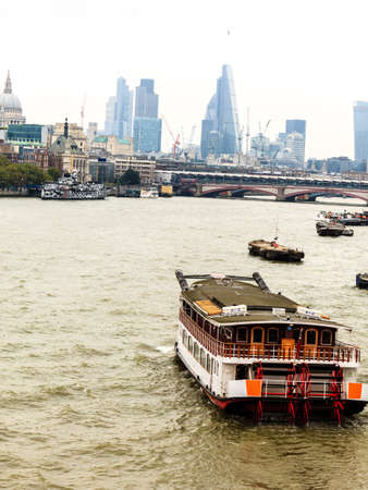 LONDON, UNITED KINGDOM - SEPTEMBER 20, 2014: River Thames with boat trips, Londonの写真素材