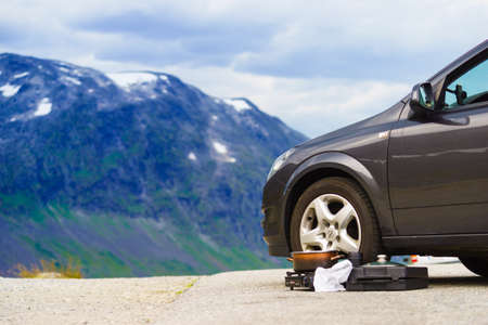 TROLLSTIGEN, NORWAY - JULY 28, 2018: Camping portable Abarqs tourist gas stove on the cartouches with suitcase. Cooking outdoor. Travel tools, explorer equipment.のeditorial素材