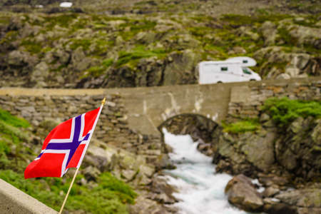 Camper car drive over river on national tourist scenic route Gamle Strynefjellsvegen, Southern Norway. Travel in motor home.の写真素材
