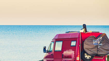 Caravan recreational vehicle on mediterranean coast in Spain. Camping on nature. Vacation and travelling in mobile home.の写真素材