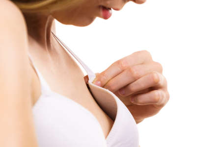 Young woman small boobs wearing bra with big gaping cup.の写真素材