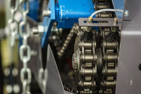 Chain drive and gear in the mechanism, industrial machine detail view