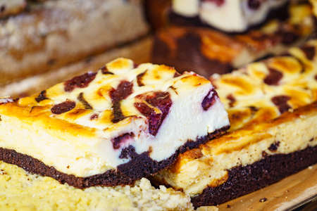 Basked cheesecake with fruit and chocolate. Delicious dessert.