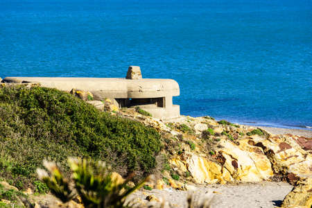 Sea with war bunker on Torrecarbonera beach, Punta Mala, Andalusia Spain.
