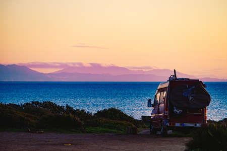 Camper van on mediterranean coast, beach Torrecarbonera, Punta Mala, Alcaidesa, Spain. Vacation and...