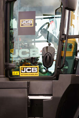 Bednary near Poznan, Poland - September 20, 2019: Logo of british brand JCB on tractor heavy...
