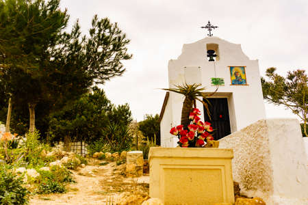 Santa Pola, Spain - March 6, 2019: Small roadside chapel on mediterranean coast of seaside spanish Santa Pola city, near Alicante, Costa Blanca.の写真素材