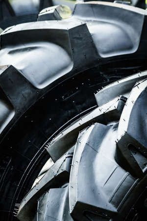 Black tyre stack of vehicle or agricultural and industrial machine. Texture background