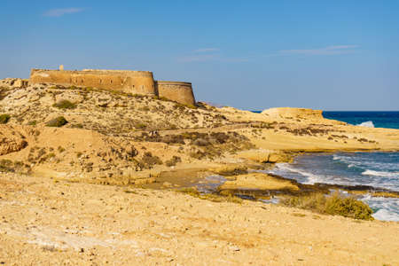 Cabo de Gata Nijar, Spain- March 22, 2019: Castle San Ramon above beach of El Playazo, Cabo de Gata park, province Almería, Andalusia region of Spain, Europe. Tourist site.のeditorial素材