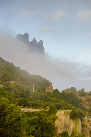 Clouds over Montserrat mountain range near Barcelona, in Catalonia Spain. Rocky landscape. Morning timeの写真素材