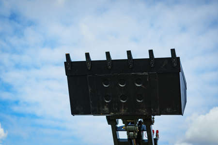 Industrial hay telehandler against sky. Telescopic handler. Agricultural machinery, farm equipment....
