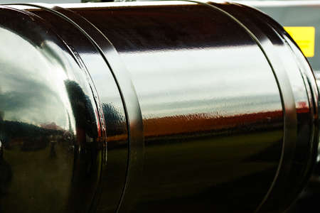 Compressed air in big black truck barrel cantainer, detail of heavy machine, industrial or agricultural machinery.の写真素材