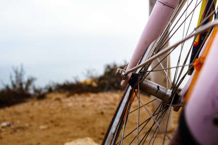 Bicycle outdoor parked on beach sea shore. Wheel element. Holidays, sport and summer recreation.