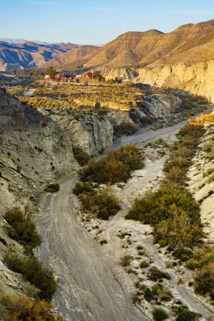Tabernas desert landscape with Western Leone village, Almeria, Spain. Movie location set for spaghetti western. View from distance.