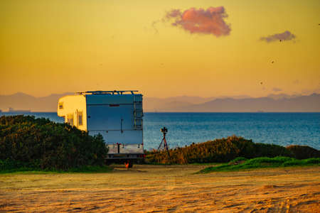 Camper on mediterranean coast, beach Torrecarbonera, Punta Mala, Alcaidesa, Spain. Vacation and travelling in mobile home.の写真素材