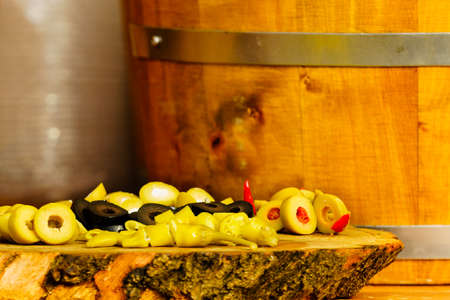 Olives and peppers for sale at outdoors food market.の写真素材