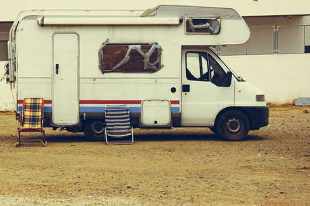 Old camper car recreation vehicle with broken windowsの写真素材