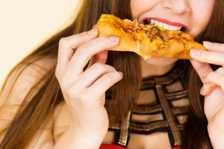 Woman with clay carbo black mask on half face and white mud on second half. Girl taking care of oily complexion. Beauty procedures. Skincare.の写真素材