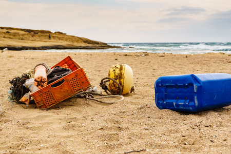 Sandy beach with old fishing rope net and tackle.の写真素材