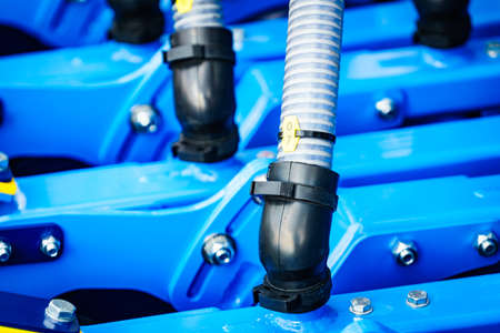 Plastic corrugated pipes in agricultural or industrial machinery. Part of hydraulic or pneumatic equipments. Technology.の写真素材