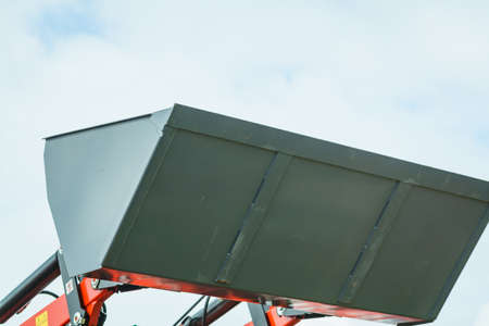 Industrial hay telehandler against sky. Telescopic handler. Agricultural machinery, farm equipment....