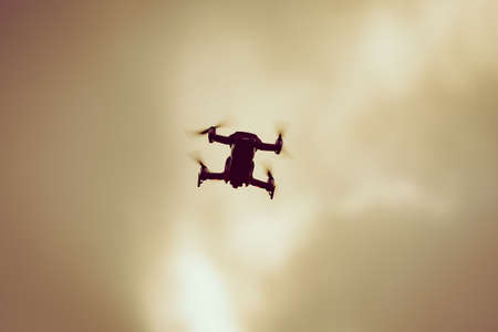 Drone flying over sky background, take photo and videoの写真素材