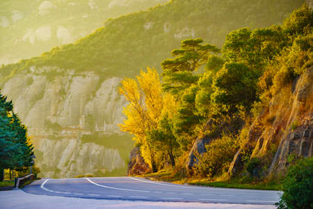 Asphalt road winding through the mountains of Montserrat, rocky landscape, Catalonia Spain.の写真素材