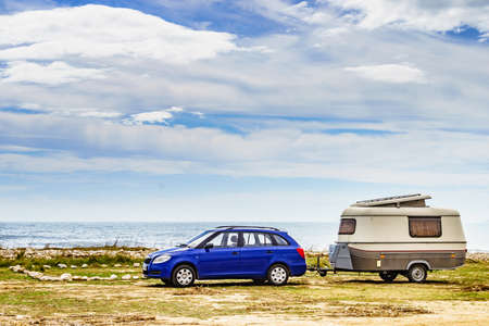 Caravan trailer camping on seashore. Capicorb, Valencia region Spain. Vacation with mobile home.の写真素材