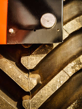 Black tire of vehicle or agricultural and industrial machine, close upの写真素材