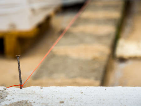 String being used as level in the construction of wall. Bricklayerの写真素材