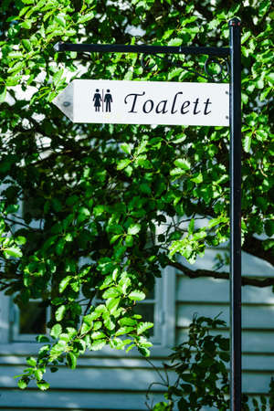 Public toilet sign outdoor in Norway. Toilet restroom.の写真素材