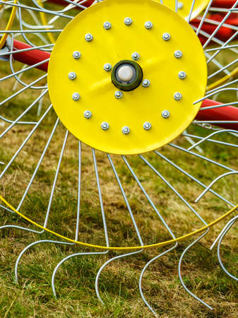 Tractor with rotary wheel hay rake, agriculture machine, detail viewの写真素材