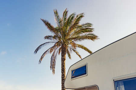 Camper rv caravan on mediterranean coast in Spain. Wild camping on nature beach. Holidays and traveling in motor home. Visiting warm winter travel destinations.の写真素材