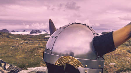 Viking helmet against mountains landscape in Norway. Tourism and traveling conceptの写真素材